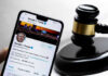 Trump’s Crypto Fortune Just Shocked Washington Smartphone displaying Twitter profile near a judges gavel.