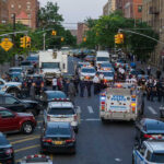 Mass Arrests After Viral Teen Gathering Police activity on a city street with emergency vehicles.