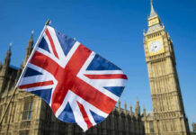 Reform UK Leader Resigned, Dares Voters to Judge Him Union Jack flag with Big Ben in the background.