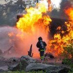 Tourists Burned Alive: Spain’s Deadliest Wildfire in Decades Firefighter battling a large fire with water spray