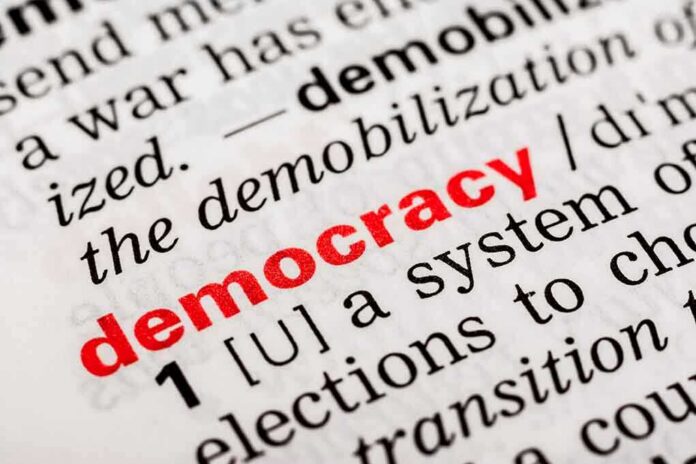 shutterstock_180506675 Close-up of a dictionary page defining the word democracy