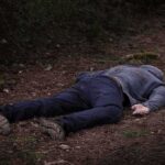 The Headlines Moved Faster Than the Evidence person lying face down on a forest path