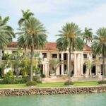 Florida’s Biggest Tax Cut Proposal Loses Its Biggest Political Champion A luxurious mansion surrounded by palm trees and a waterfront view