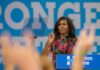woman at podium speaking to audience