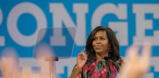 woman at podium speaking to audience