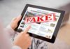 One Image: Four Numbers. A National Political Debate. Person holding a tablet displaying a news website with a 'FAKE' stamp
