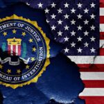 FBI Insider Allegedly Stole Nearly $1M in Crypto FBI seal and American flag on cracked wall