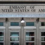 Embassy Art Purge: State Department Targets Artwork United States embassy entrance with metal doors and security camera