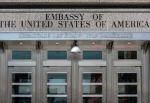 Embassy Art Purge: State Department Targets Artwork United States embassy entrance with metal doors and security camera
