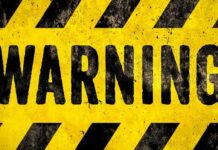 Doomsday Curve Nears: The World’s 2040 Warning warning sign with yellow and black hazard stripes