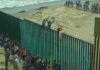“Muslim Invasion” Claim Ignites Border Debate People climbing a tall beachside border fence