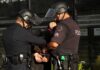 25 Arrested in San Francisco Theft Blitz Police officers handcuff a person during an arrest