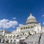 United States Capitol building under a bright blue sky