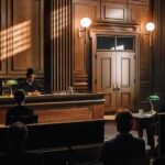 Judge presiding in a wood-paneled courtroom