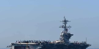 Aircraft carrier cruising at sea