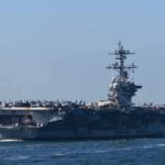 Trump Bets on Peace Instead of More Bombs Aircraft carrier cruising at sea