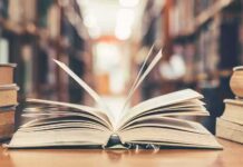 Open book on library table