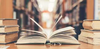 Open book on library table