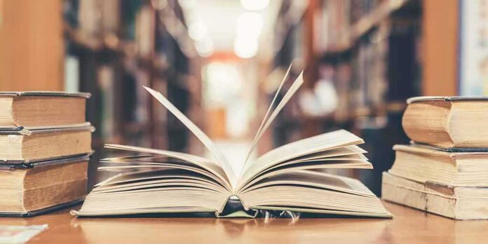 Open book on library table
