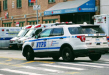 Brooklyn Assault Suspect Arrested Police car and ambulances outside emergency room entrance.
