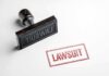 Judge Smacks Down: Naming Fight Heads to Court Rubber stamp with red lawsuit imprint on white paper