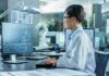 Scientists Reassess Extreme Climate Projections Engineer in lab coat working at a computer in a modern lab