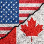 U.S.-Canada Antitrust Cooperation Put on Hold USA and Canada flags with a cracked border