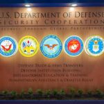 Monroe Doctrine Revival Shocks Latin America U.S. Department of Defense display wall with service seals