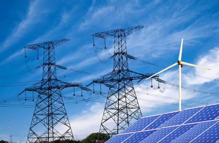 shutterstock_138865700-1 Power lines with wind turbine and solar panels