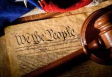 The ‘House of Horrors’ Trial Just Got Even Bigger U.S. Constitution with gavel and flag