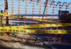 Rare Kill Order Issued After Fatal Shark Attack Orange safety net and yellow police tape blocking a beach access