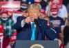 Trump Stands Firm on Iran War speaker pointing during a rally