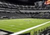 American football stadium interior with empty field and stands