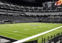 Mayfield Suffers Dislocated Right Thumb American football stadium interior with empty field and stands