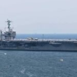 Carrier Name Fight Ignites — Why Now? Aircraft carrier sailing at sea