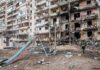 Deadly Blast Kills Six Near Acropolis Damaged apartment building behind a playground slide