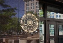Workforce Cuts Come With a $9.5B Leave Bill FBI seal on a building entrance
