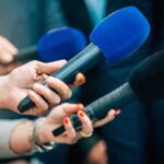 Detective Couldn’t Verify The Claims Reporters holding colorful microphones