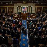 44 Members of Congress Named in Records Dispute Legislative chamber audience stands and applauds