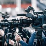 Missouri Candidate Accused of Plotting Drug Broadcast cameras on tripods at a press event