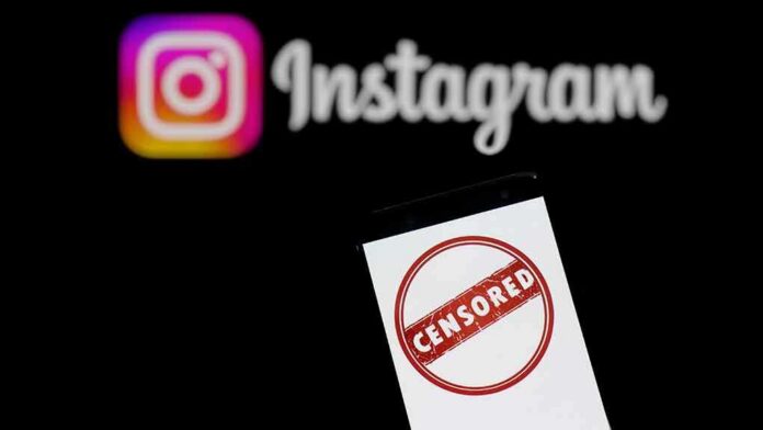 Smartphone showing censored symbol with Instagram logo in background