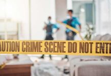 Two Convicted in Tourist-Targeting Scheme crime scene tape in a living room with two officers in background