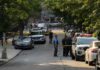 Toddler Death Case Heads to Court Police officers secure a residential street with patrol cars and yellow tape