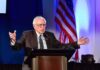 A New Vision for U.S. Foreign Policy elderly man speaking at a podium with arms outstretched