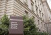 Judge Orders NYC to Redo Second-Home Tax Roll Internal Revenue Service Building sign outside a classical stone office building