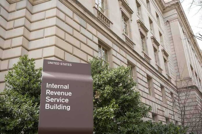 shutterstock_395324863 Internal Revenue Service Building sign outside a classical stone office building