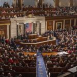 New Federal AI Rules Take Shape Legislative chamber filled with attendees during a formal address