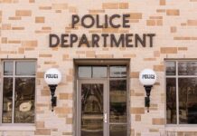 Police department building entrance with signage
