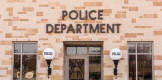 Police department building entrance with signage