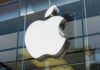 Apple logo on a glass storefront